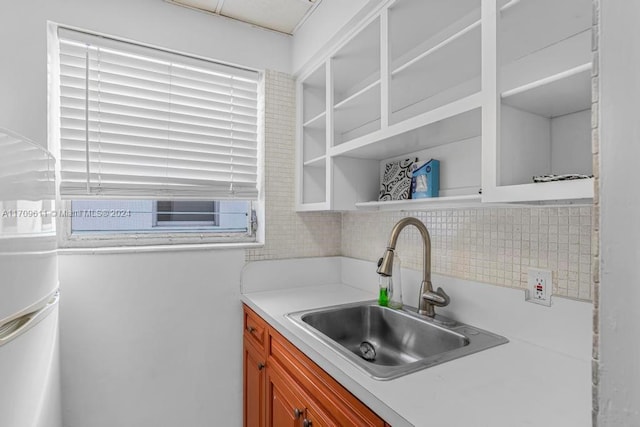 kitchen featuring tasteful backsplash and sink