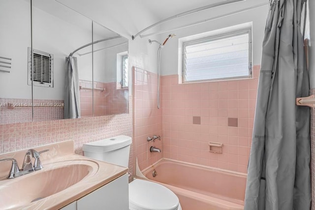 full bathroom featuring vanity, toilet, and shower / bath combo with shower curtain