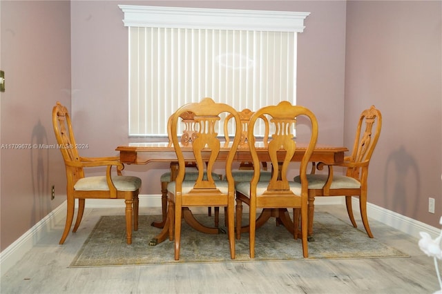 dining space featuring hardwood / wood-style flooring