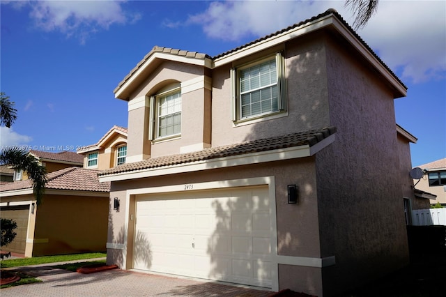 view of front of property with a garage