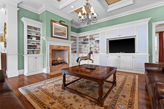 living room with built in shelves, crown molding, a high end fireplace, and dark wood-type flooring