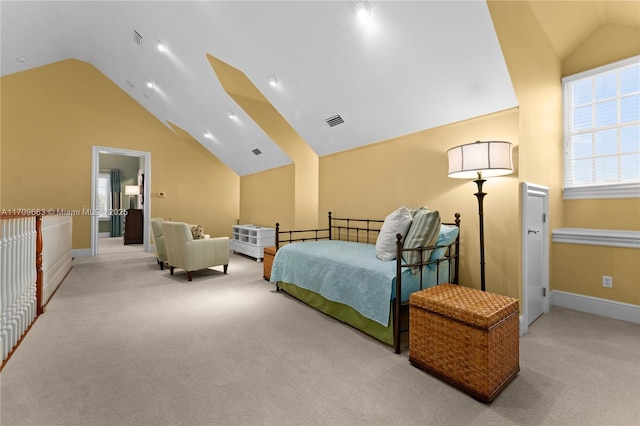 carpeted bedroom with lofted ceiling