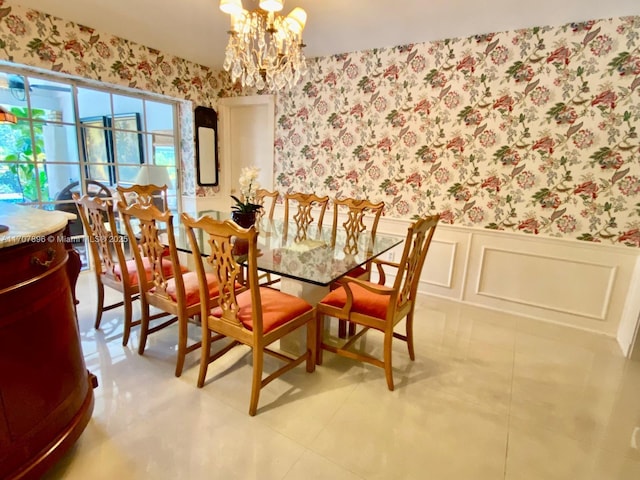 dining area with light tile patterned floors and a chandelier