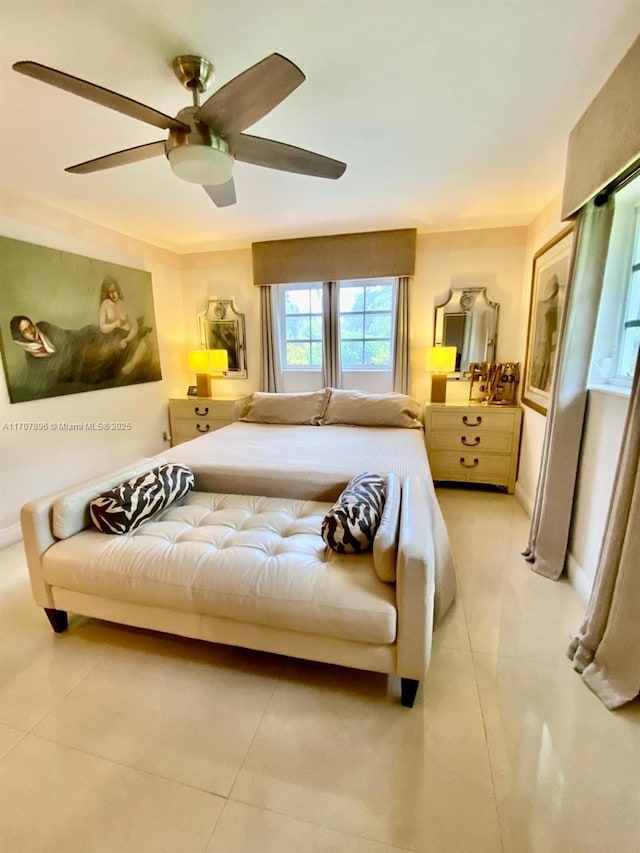 bedroom with ceiling fan and light tile patterned flooring