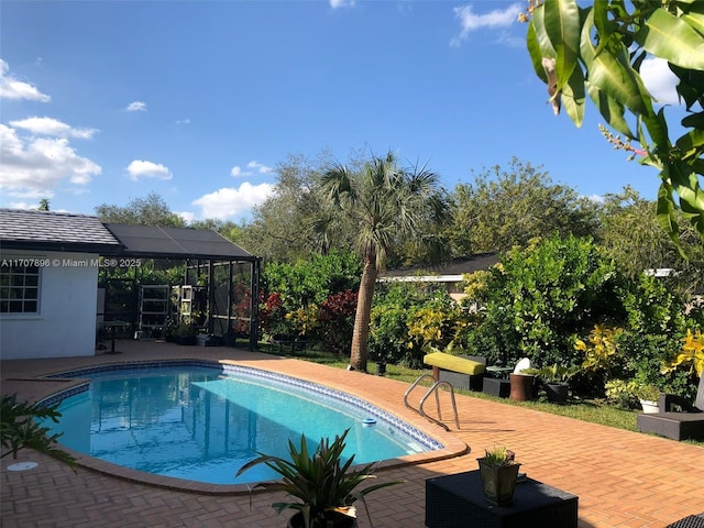 view of swimming pool with a patio