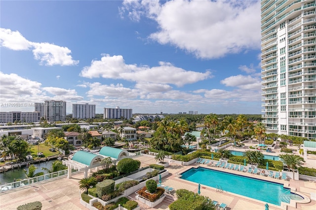 view of pool with a water view