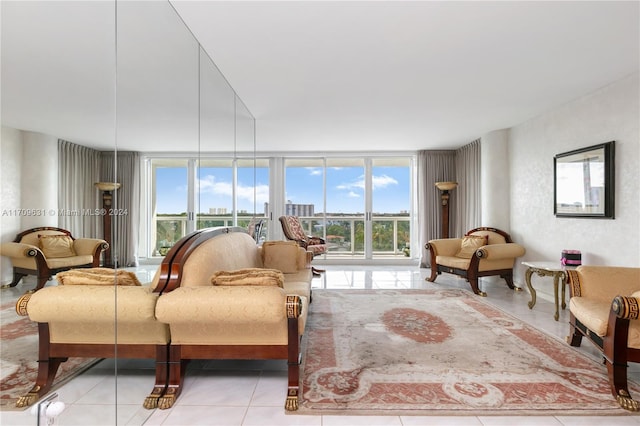 living room featuring expansive windows, a wealth of natural light, and light tile patterned flooring