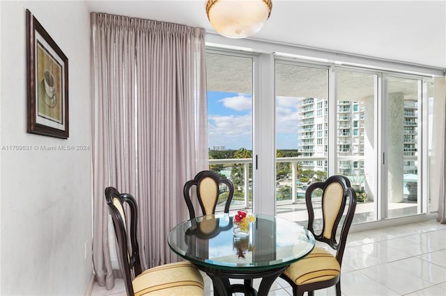 dining area with plenty of natural light and light tile patterned flooring