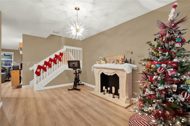 interior space with hardwood / wood-style flooring and an inviting chandelier