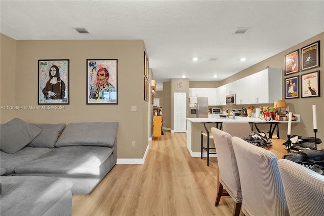 living room with light hardwood / wood-style floors