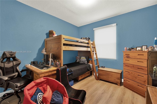 bedroom with light wood-type flooring