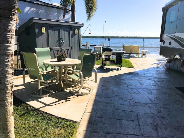 view of patio / terrace with a water view