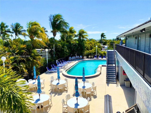 view of swimming pool with a patio