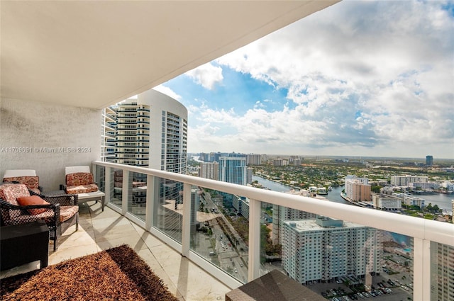 balcony featuring a water view