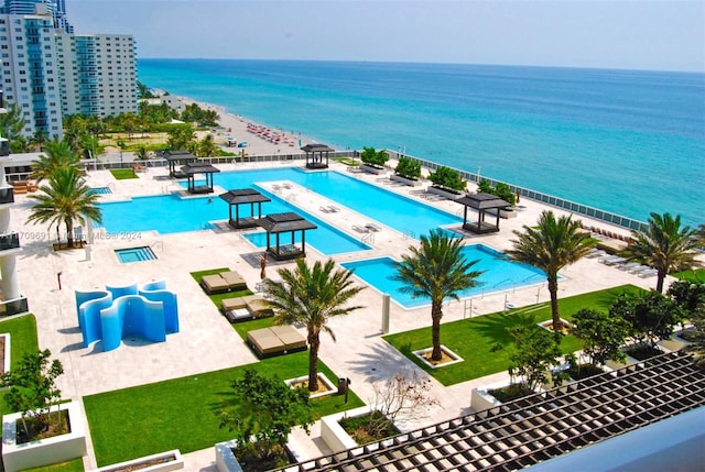 view of swimming pool with a water view