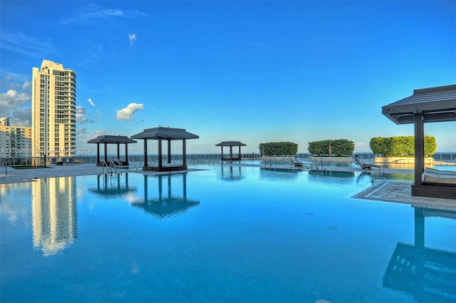 view of pool with a water view