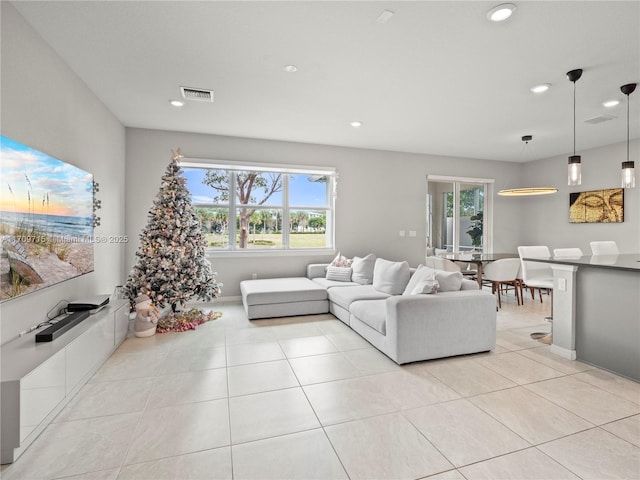 living room with light tile patterned flooring