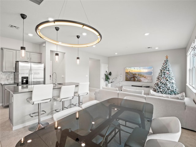 dining area with light tile patterned flooring