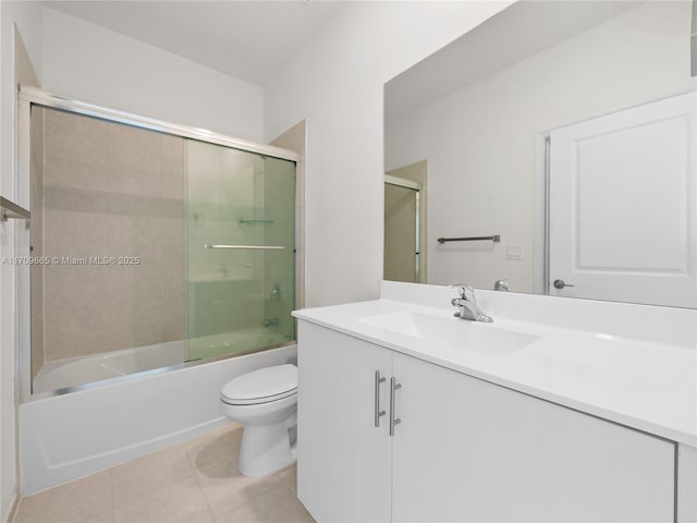 full bathroom featuring tile patterned flooring, vanity, toilet, and enclosed tub / shower combo