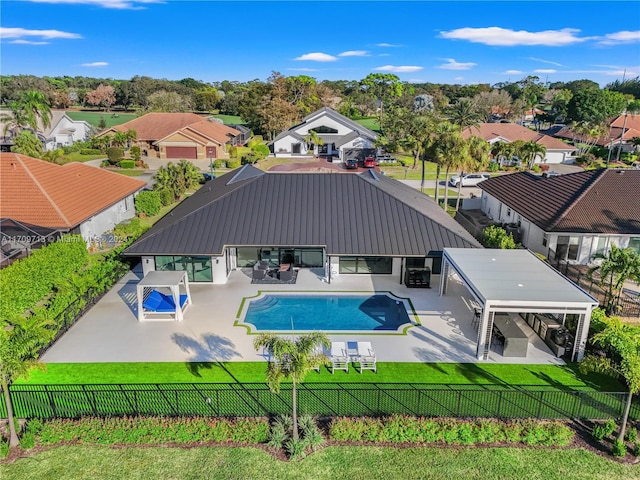 view of pool with a lawn and a patio area