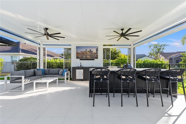 view of patio featuring outdoor lounge area and ceiling fan