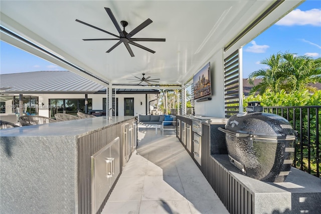 view of patio / terrace with ceiling fan and area for grilling