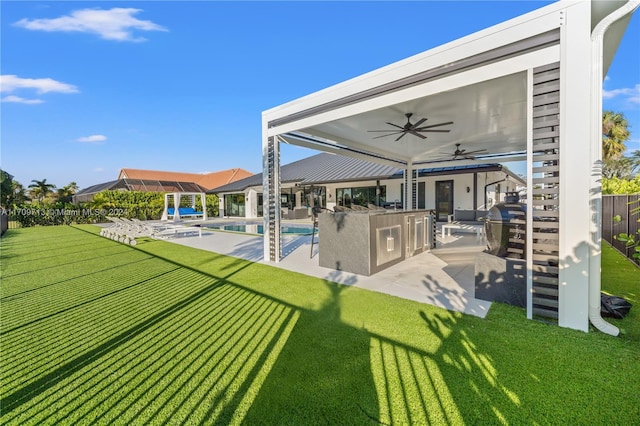 exterior space featuring a fenced in pool, area for grilling, ceiling fan, and a patio area