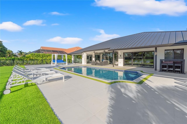 view of swimming pool featuring an outdoor living space, a patio area, and a yard