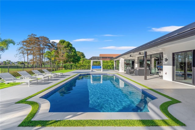 view of swimming pool featuring an outdoor hangout area, ceiling fan, and a patio area