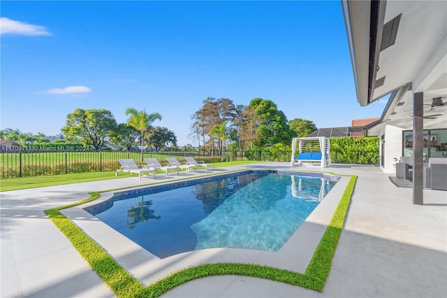 view of pool featuring a patio area