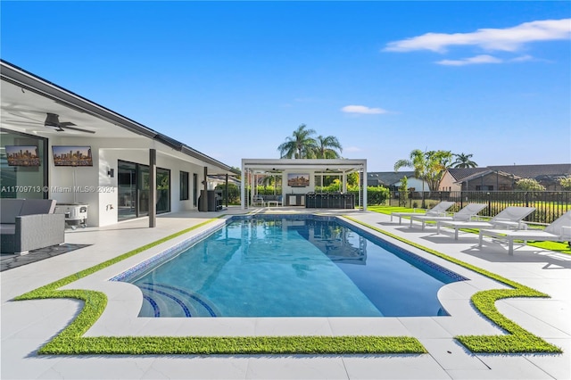 view of pool featuring ceiling fan and a patio area