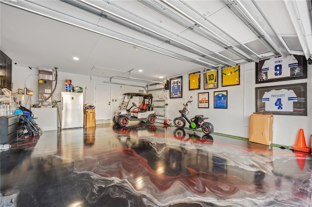 garage featuring stainless steel fridge