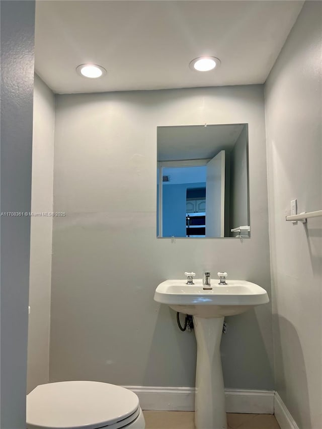 bathroom with tile patterned floors and toilet