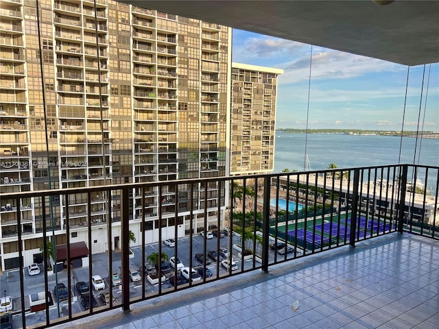 balcony featuring a water view