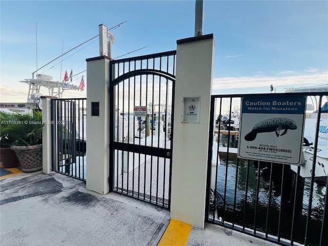 view of gate with a water view