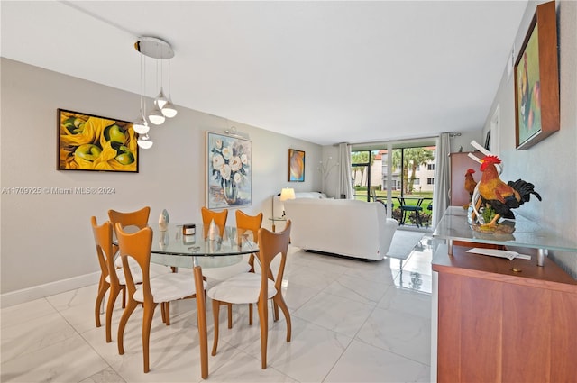 dining space featuring french doors and a wall of windows