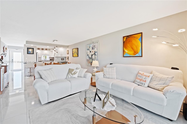 living room with light tile patterned flooring