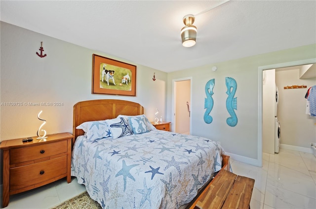 bedroom featuring washer / clothes dryer