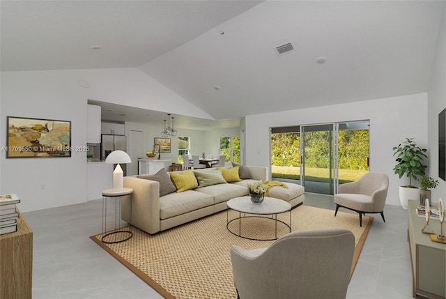 living area with visible vents and high vaulted ceiling