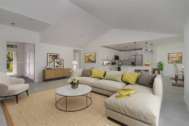 living area featuring visible vents and high vaulted ceiling