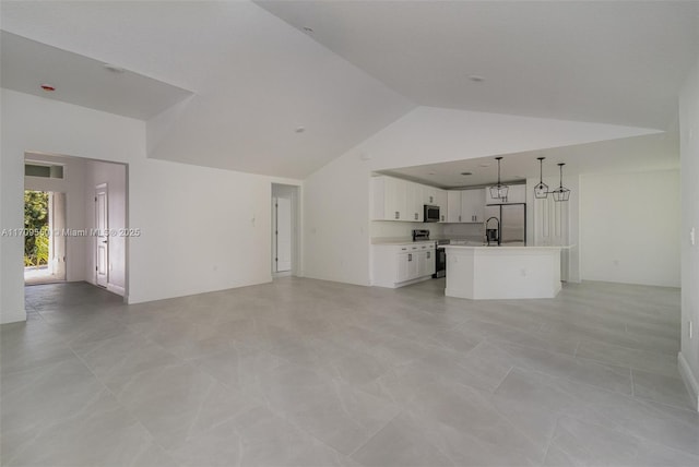 unfurnished living room with visible vents and high vaulted ceiling