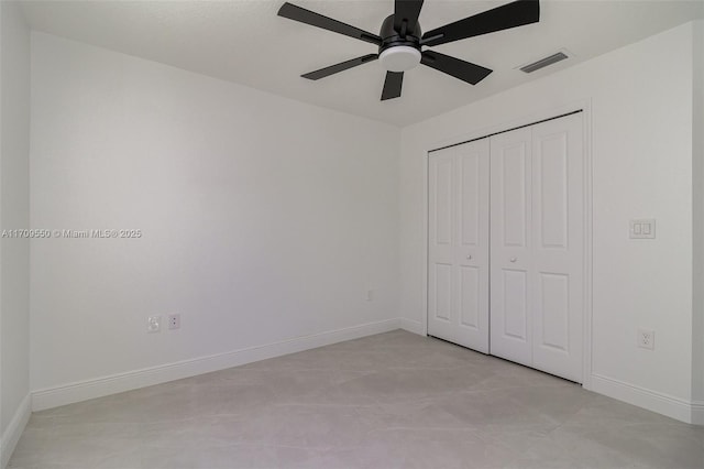 unfurnished bedroom featuring visible vents, baseboards, a closet, and a ceiling fan