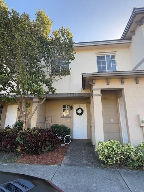 1967 Marsh Harbor Dr Unit 313, Riviera Beach, FL 33404 - doorway to property with stucco siding