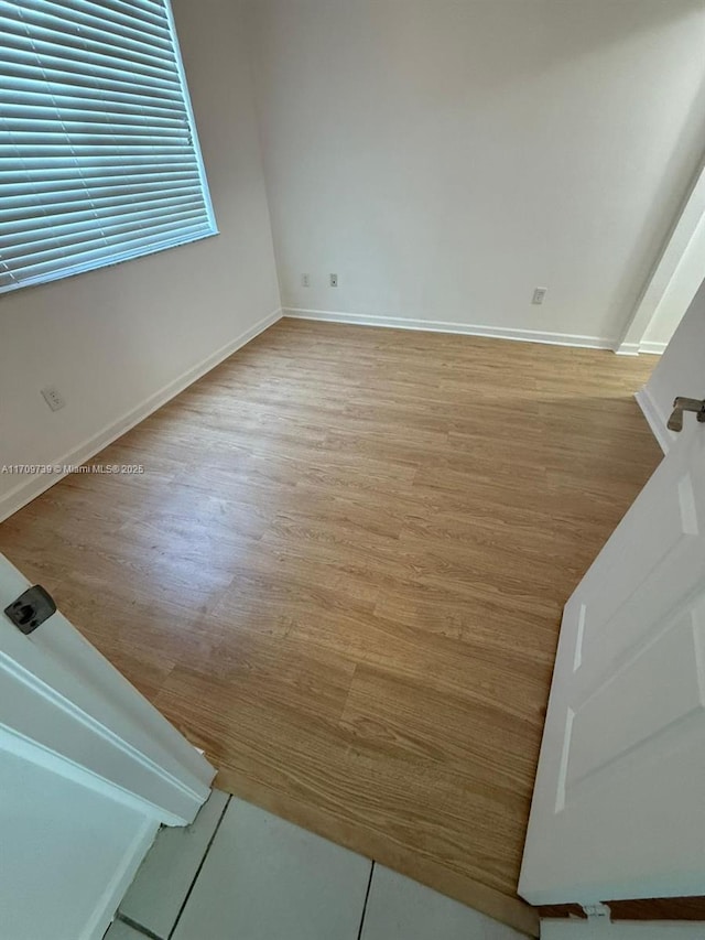 1967 Marsh Harbor Dr Unit 313, Riviera Beach, FL 33404 - empty room featuring light wood-style floors and baseboards