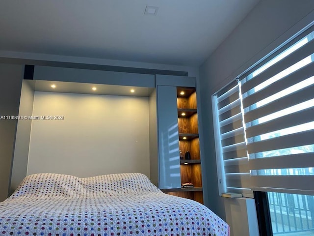 bedroom featuring multiple windows