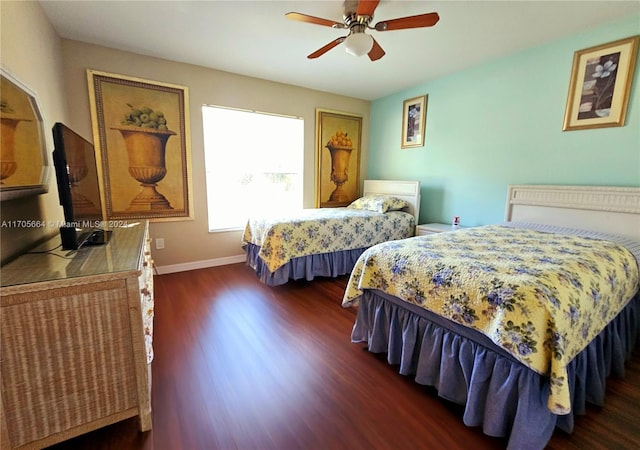 bedroom featuring ceiling fan and dark hardwood / wood-style flooring