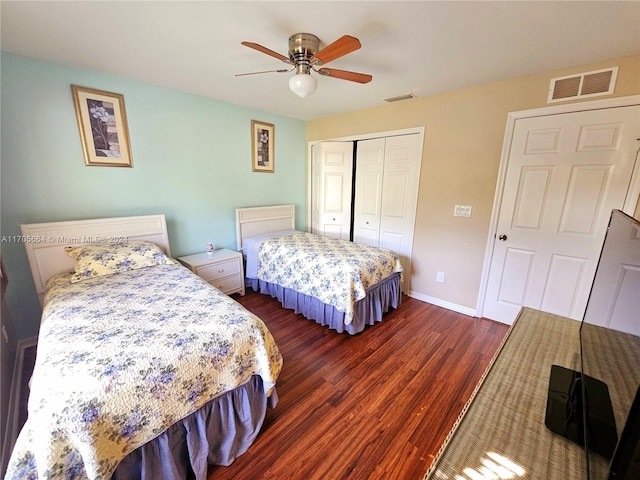 bedroom featuring a closet, ceiling fan, and dark wood-type flooring