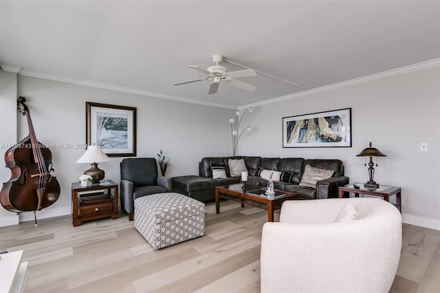 living room featuring light hardwood / wood-style floors, ceiling fan, and crown molding