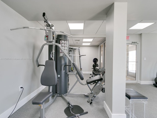 exercise area featuring a paneled ceiling