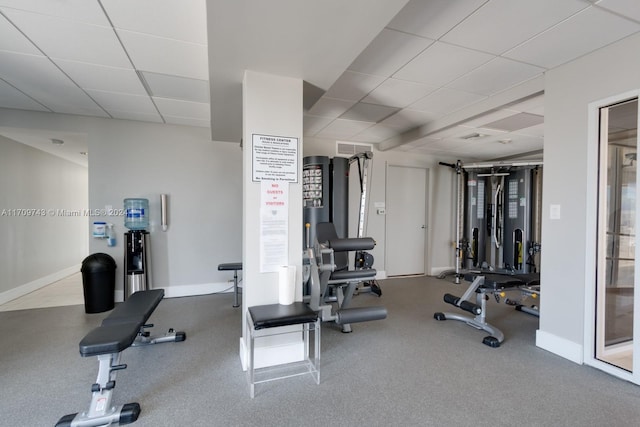 workout area with a paneled ceiling